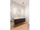 Stylish powder room with a floating vanity and geometric wallpaper at 816 Hillwood Dr, Marietta, GA 30068