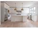 Spacious kitchen featuring white cabinets, a large island, and high-end appliances at 816 Hillwood Dr, Marietta, GA 30068