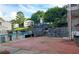 Charming community patio with brick flooring and a barbecue, ideal for social gatherings and outdoor dining at 1150 Collier Nw Rd # 4B, Atlanta, GA 30318