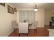 Dining room featuring hardwood floors, neutral-toned furniture, and wall decorations at 1150 Collier Nw Rd # 4B, Atlanta, GA 30318
