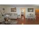 Cozy living room with hardwood floors, neutral-toned furniture, and a view into a bedroom at 1150 Collier Nw Rd # 4B, Atlanta, GA 30318