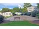 Community sand volleyball court with bench seating, offering a fun recreational activity for residents at 1150 Collier Nw Rd # 4B, Atlanta, GA 30318