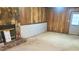 Spacious basement room with wood paneling and a stone fireplace at 1593 Cherry Hill Ln, Conyers, GA 30094