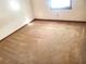 Spacious carpeted bedroom with large window at 1593 Cherry Hill Ln, Conyers, GA 30094