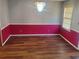 Dining room with hardwood floors and two-tone walls at 1593 Cherry Hill Ln, Conyers, GA 30094