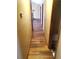 Long hallway with wood-look flooring at 1593 Cherry Hill Ln, Conyers, GA 30094