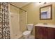 Bathroom with walk-in shower, neutral colored walls, and a vanity with a dark wood cabinet at 511 Barrington Hills Dr, Atlanta, GA 30350