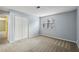 Spacious bedroom with large window and closet with carpet floors, allowing for great natural light at 511 Barrington Hills Dr, Atlanta, GA 30350