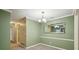 The dining room has fresh paint, trim, a modern light and is carpeted at 511 Barrington Hills Dr, Atlanta, GA 30350