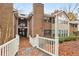 Exterior view with wooden bridge leading to brick apartments with trees surrounding the property at 511 Barrington Hills Dr, Atlanta, GA 30350