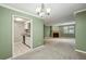 This living room flows into the kitchen for an open concept living space at 511 Barrington Hills Dr, Atlanta, GA 30350