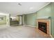 Spacious living room showcases an open floor plan and cozy fireplace feature at 511 Barrington Hills Dr, Atlanta, GA 30350