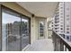 Covered balcony with sliding glass doors and exterior door at 795 Hammond Dr # 401, Atlanta, GA 30328