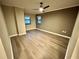 Bright bedroom with hardwood floors and ceiling fan at 795 Hammond Dr # 401, Atlanta, GA 30328