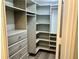 Large walk-in closet with built-in shelves and drawers at 795 Hammond Dr # 401, Atlanta, GA 30328