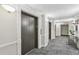 Building hallway with elevators and carpet at 795 Hammond Dr # 401, Atlanta, GA 30328