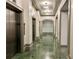 Clean hallway with marble floors and elevators at 795 Hammond Dr # 401, Atlanta, GA 30328