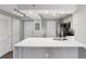 Modern kitchen with white cabinets, stainless steel appliances and breakfast bar at 795 Hammond Dr # 401, Atlanta, GA 30328