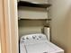 Small laundry closet with washer and dryer at 795 Hammond Dr # 401, Atlanta, GA 30328