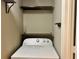 Stackable Whirlpool washer and dryer with added shelving at 795 Hammond Dr # 401, Atlanta, GA 30328