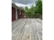 Large wood deck, with view of lush trees, perfect for outdoor entertaining at 2467 Shady Grove Rd, Carrollton, GA 30116