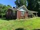 Charming single-story brick house with a covered porch and well-maintained front yard at 2467 Shady Grove Rd, Carrollton, GA 30116