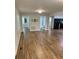 Spacious living room featuring wood-look floors and multiple entryways at 2467 Shady Grove Rd, Carrollton, GA 30116
