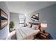 Cozy bedroom with a comfortable bed, contemporary art, and a large window at 375 Ralph Mcgill Blvd # 603, Atlanta, GA 30312