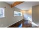 Empty bedroom showcasing wood floors, neutral walls, and bright, natural light at 341 Little John Nw Dr, Lilburn, GA 30047