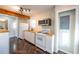 Cozy kitchen with white appliances, wood countertops, and modern track lighting at 341 Little John Nw Dr, Lilburn, GA 30047