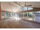 Bright sun room with large windows and hardwood floors at 341 Little John Nw Dr, Lilburn, GA 30047