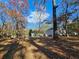 Spacious backyard with mature trees and leaves at 1877 Lomita Rd, Atlanta, GA 30316