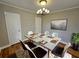 Modern dining room with concrete table and stylish chandelier at 1877 Lomita Rd, Atlanta, GA 30316