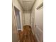 Hardwood floors and neutral walls in this home's hallway at 1877 Lomita Rd, Atlanta, GA 30316