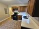 Modern kitchen featuring dark wood cabinets and quartz countertops at 1877 Lomita Rd, Atlanta, GA 30316