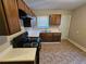 Modern kitchen featuring dark wood cabinets and quartz countertops at 1877 Lomita Rd, Atlanta, GA 30316