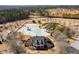 Aerial view of community pool, waterslide, landscaping, and the clubhouse at 243 Yorkshire Ln, Villa Rica, GA 30180