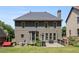 Two-story home showcasing backyard with deck at 243 Yorkshire Ln, Villa Rica, GA 30180