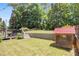 The spacious backyard with a playhouse and plenty of room to play and garden is seen here at 243 Yorkshire Ln, Villa Rica, GA 30180