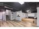 Finished basement with wood-look floors and an entertainment area with a projector screen at 243 Yorkshire Ln, Villa Rica, GA 30180