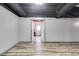 Finished basement featuring sleek wood-look flooring and an open doorway to another part of the home at 243 Yorkshire Ln, Villa Rica, GA 30180