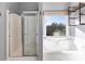 Bright bathroom featuring a shower, soaking tub, and natural light from a window at 243 Yorkshire Ln, Villa Rica, GA 30180