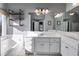 Luxurious bathroom with double vanity, a soaking tub, and modern fixtures, designed for comfort and style at 243 Yorkshire Ln, Villa Rica, GA 30180