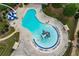 Aerial view of the community pool with splash pad, water features, and lounge seating at 243 Yorkshire Ln, Villa Rica, GA 30180