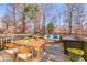 Back deck with outdoor furniture and wood-like flooring at 243 Yorkshire Ln, Villa Rica, GA 30180