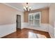 Dining room featuring hardwood floors, wainscoting and natural lighting at 243 Yorkshire Ln, Villa Rica, GA 30180