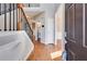 Elegant foyer with hardwood floors, staircase with iron railings, and a glimpse of the interior at 243 Yorkshire Ln, Villa Rica, GA 30180