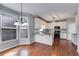 Open concept kitchen featuring bay windows, stainless steel appliances and island with granite countertops at 243 Yorkshire Ln, Villa Rica, GA 30180