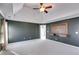 A spacious room featuring dark-colored walls and tray ceiling at 243 Yorkshire Ln, Villa Rica, GA 30180