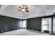 Bright main bedroom showing a tray ceiling, carpeted floor, and large windows with white curtains at 243 Yorkshire Ln, Villa Rica, GA 30180